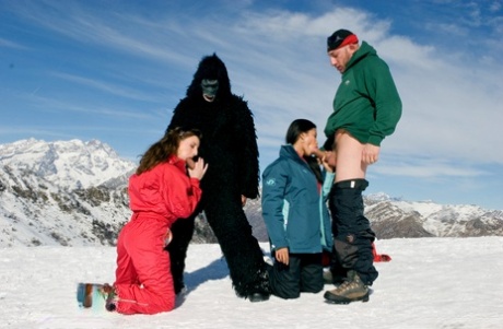 After being placed on a mountaintop, two snow bunnies are seen peeing from their chins in this pussy to mouth action.