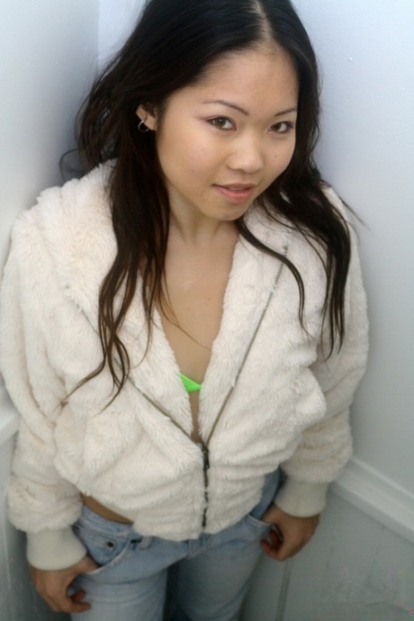 To model in a bikini, Grace is an Asian first timer who removes her hooded coat.