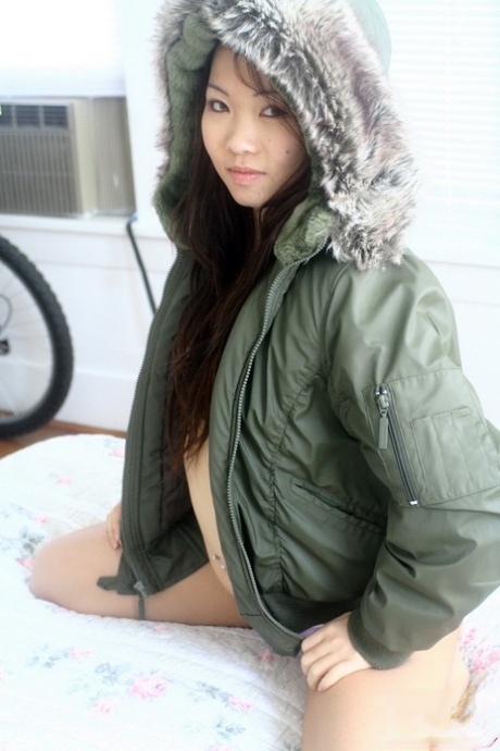 Asian Amateur Grace Removes A Winter Coat To Model A Thong During SFW Action
