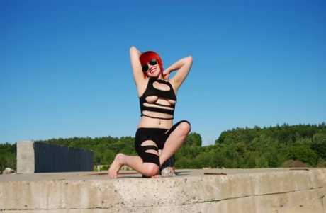 Redheaded Teen Sabrina Exposes Herself On Top Of A Concrete Structure