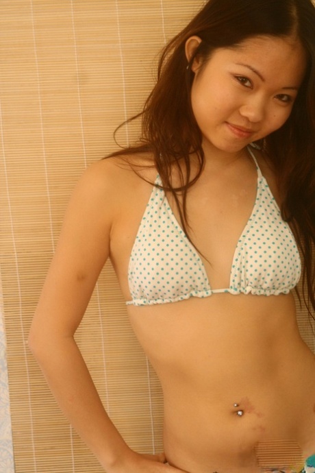 Adorable Asian Teen Grace Undoes Her Bikini Top In A Teasing Manner