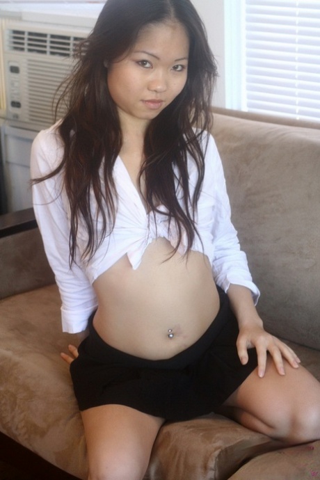 When safe for work action, Grace reverses her halter top as an Asian amateur.