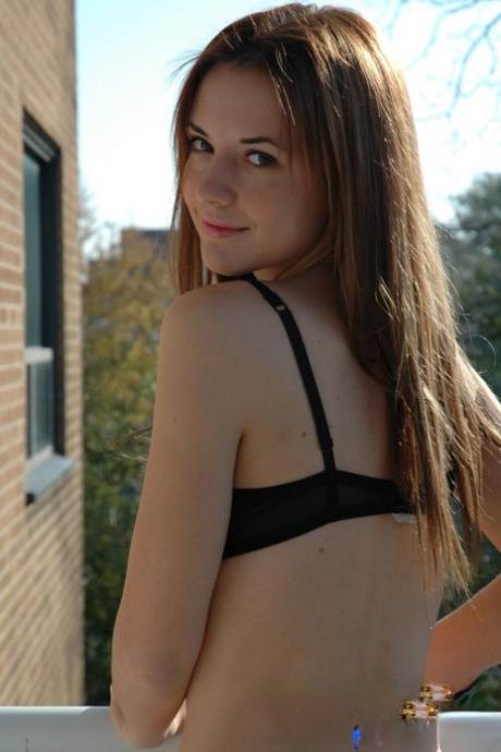 Amateur Teen Steps Out Onto Her Apartment Balcony In Her Bra And Shorts