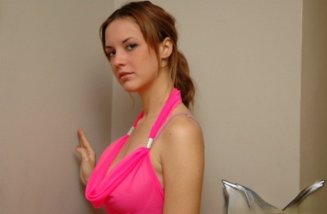 White Teen Of Legal Age Hikes Up Her Pink Dress To Expose Her Bare Ass