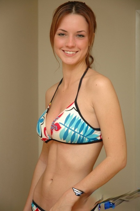 Young Solo Girl Amy Wears A Smile While Posing Non Nude In A String Bikini