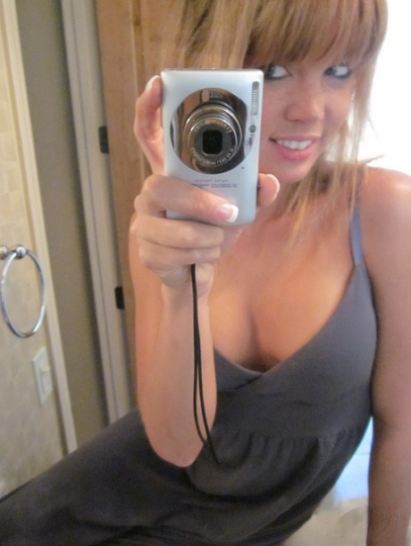 Adorable young girl, Diddylicious goes without clothes in a bathroom to take selfies.