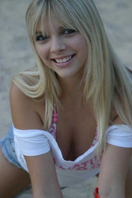 Cute Blonde Jana Jordan In A Short Skirt Flashing Cleavage At The Beach
