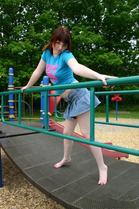 Plaything: Pigeon tail Barbie flashes her perky tits on the playground.