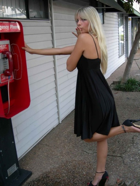 During a public phone call, Jana Jordan showcases her panties while being an unassuming blonde amateur.