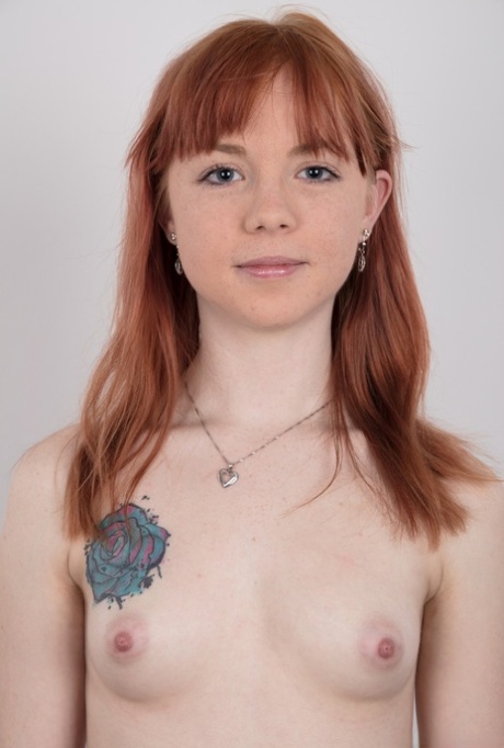 Cute Redhead Amateur Uncovers Her Barely Budding Breasts As She Gets Naked