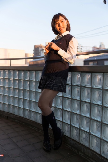 Japanese schoolgirl uncups natural tits after flashing cotton underwear