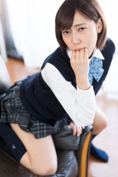 Japanese schoolgirl uncups natural tits after flashing cotton underwear