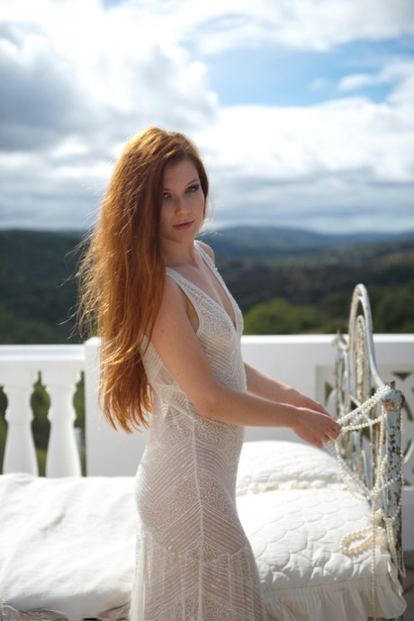 Pale Redhead Mia Sollis Slips Out Of A See Thru Dress To Pose Nude On Balcony