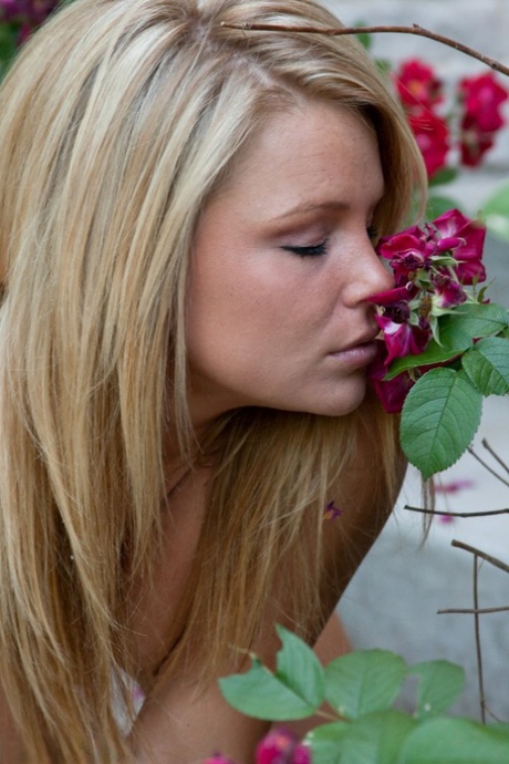 Blonde Female Meet Madden Smells The Roses While Undressing On Front Steps