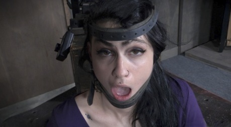 The neck fucked by the restrained brunette Lydia Black is part of this scene in one of the dungeons.