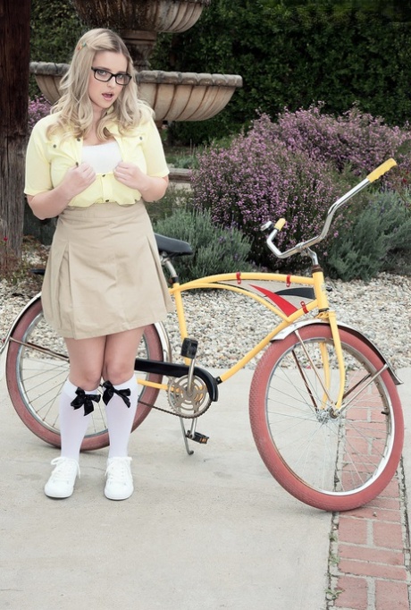 To reveal her plump big tits, Codi Vore, the gorgeous woman, parks her bicycle.