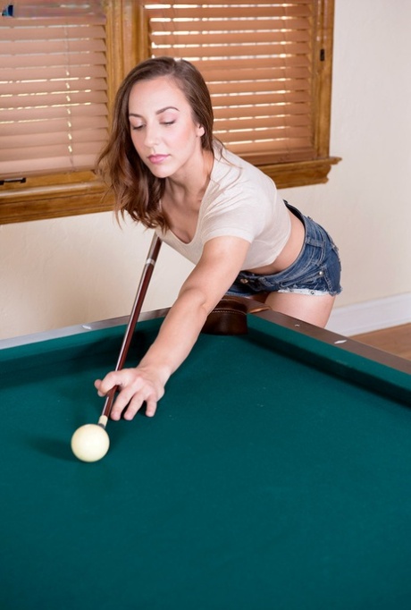 Uncommon girl Desire exposes her tiny tits while shooting pool by herself.