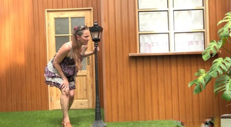 Blonde woman Nicol D hikes short dress to pee standing behind the house #1
