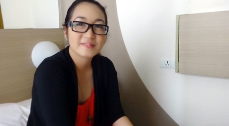 Nerdy Filipina girl bares legs and undresseses before having sexual intercourse with an unknown stranger.