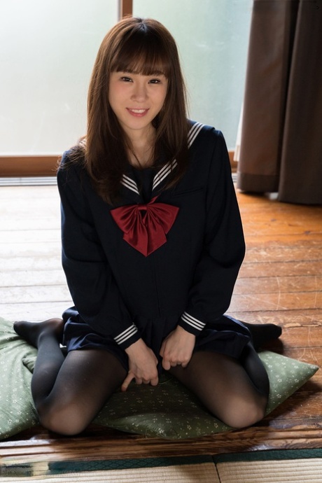 Uncover her slim figure from school attire and place it on a cushion, as the Japanese student does.