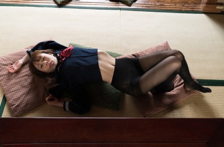 Ease off slim from school clothes on a cushion: This Japanese student is seen here in her school uniform.