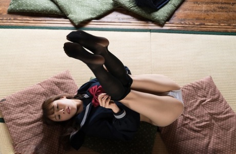 Japanese Student Releases Her Slim Body From Her School Outfit On A Cushion