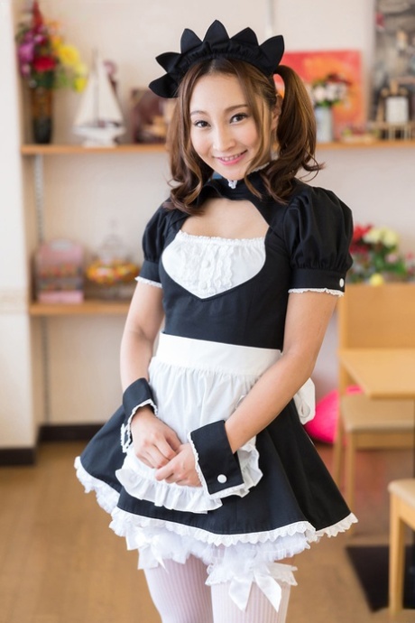 The boss of a cute Japanese maid gives her a handjob after watching her masturbate.