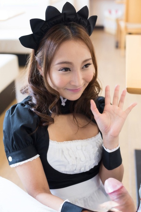 Cute Japanese maid enjoying a cunny with her mouth open.