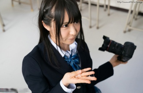 Japanese Schoolgirl Puts Down Her Camera Long Enough To Suck Off Her Teacher