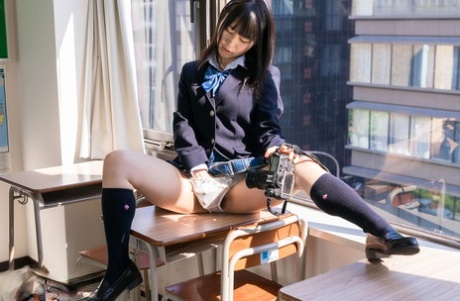 A Japanese student is seen taking selfies while removing her upskirt panties from her wardrobe.