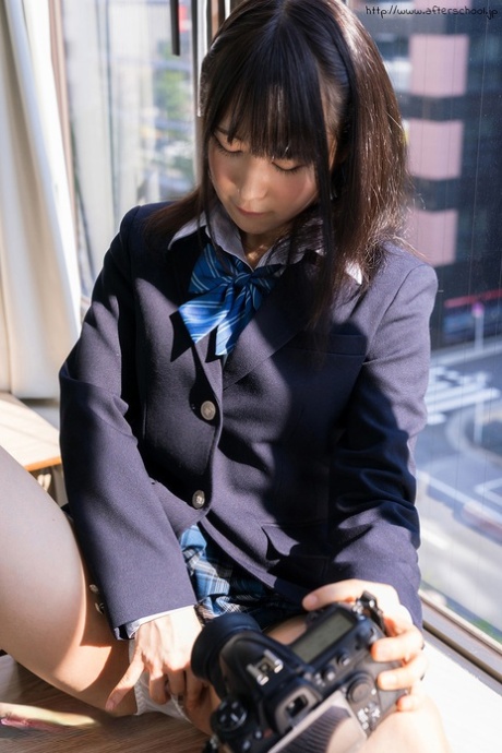 Japanese student slides her upskirt panties aside while taking self shots