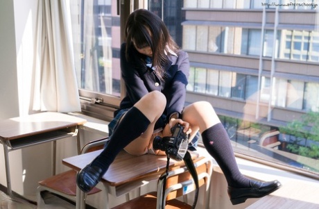 Japanese student slides her upskirt panties aside while taking self shots