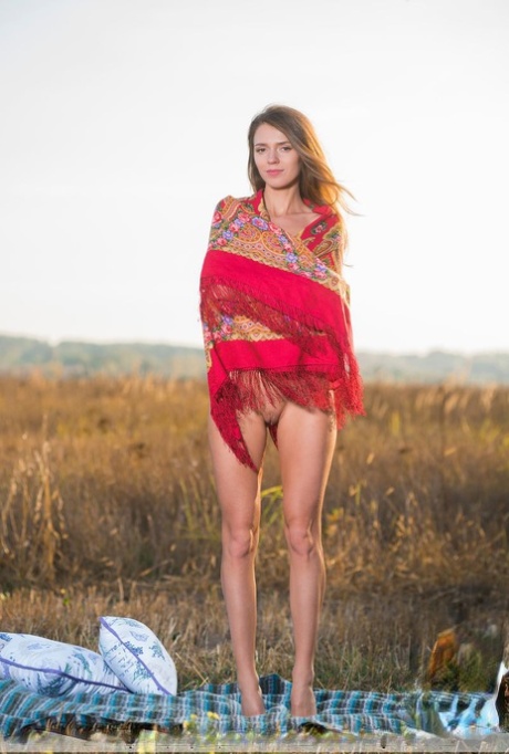 Teen model Mary Kalisy gets totally naked while having a picnic in a field