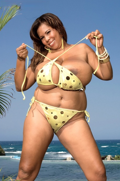 Vanessa Del, who is a solo female from Cuba, releases her massive breasts from her bikini top.