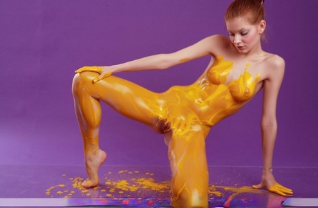 Slender redhead Angelina B covers her totally naked body with body paint sex scene #3