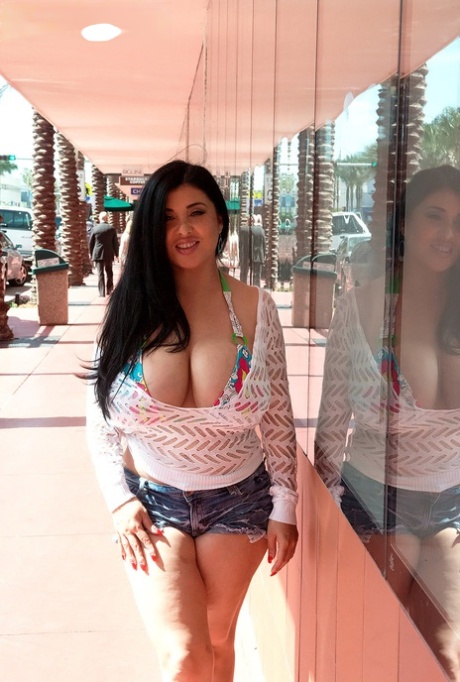 The Latina woman, Daylene Rio (left) releases her massive tits from bikini tops.