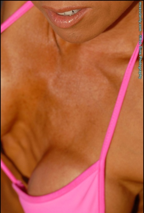 At the beach, Asian fitness model Jennifer Dejoya can be seen wearing revealing pink bikinis.