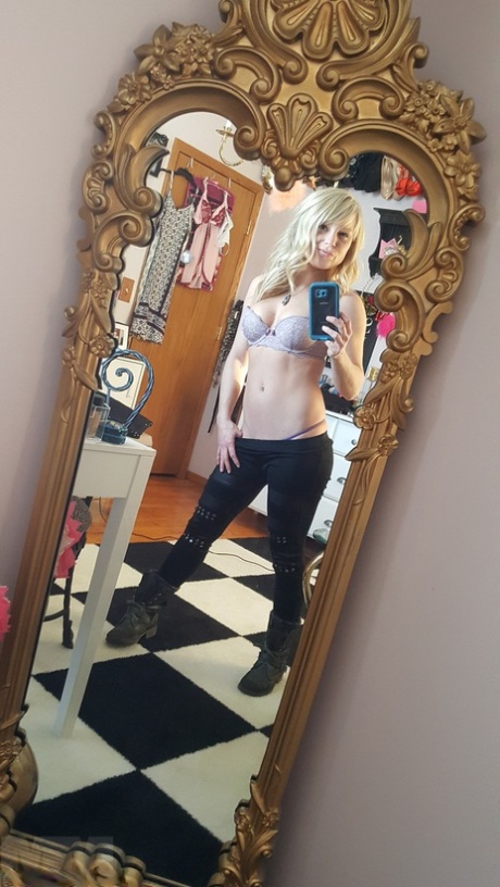 Taking selfies with her clothes off is how Meet Madden, an adorable blonde amateur, goes.