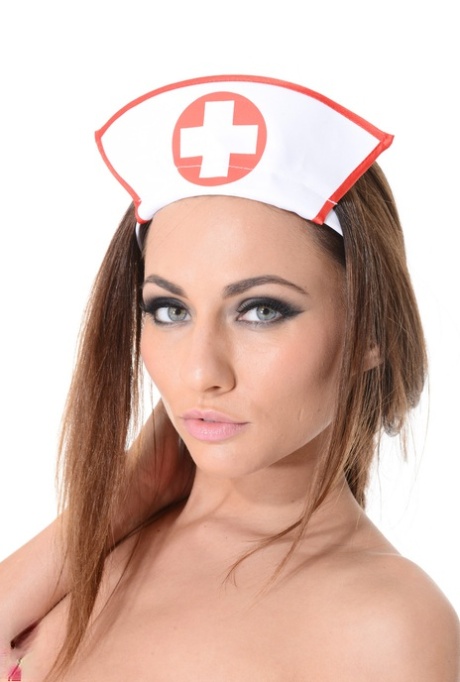 Sexy Nurse Isizzu Takes Off Her Uniform In A Garter Belt And White Nylons