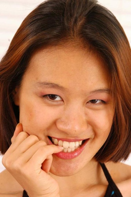 Asian teen May strips totally naked prior to a finger fuck