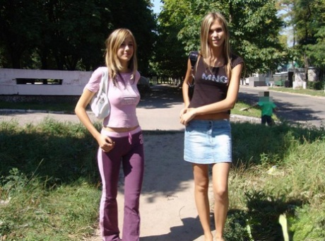 Cute teen lesbians flash their small tits while walking down the road