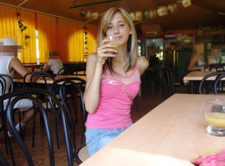 Dirty blonde teen flashes a no panty upskirt inside a restaurant