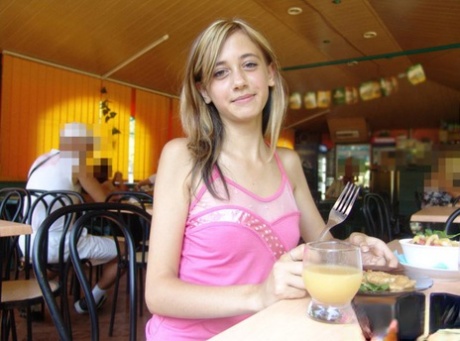 Dirty blonde teen flashes a no panty upskirt inside a restaurant