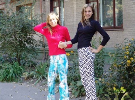 Teenagers Laura & Katrina show off their tits and buttocks while wandering about.