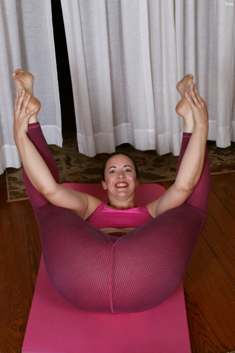 Yoga poses: This middle-aged lady shows off her 'hairy' vagina.
