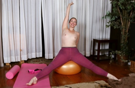 During some yoga poses, the middle age lady shows off her hairy vagina.