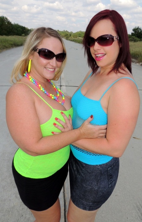 Lesbians with big asses, Dee Siren and Virgo Peridot, kiss and fist their pussies in public.