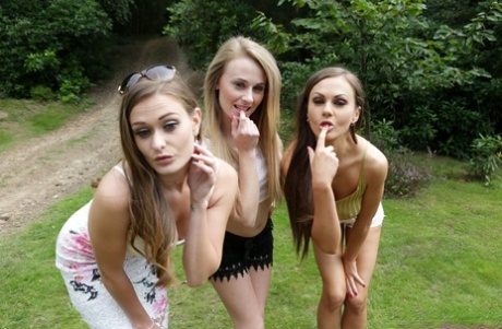 Three hotties please a horny voyeur by the side of a private lake