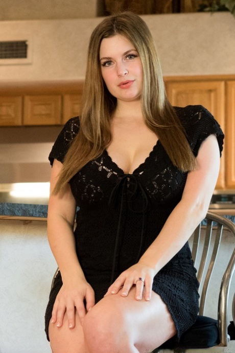 Chubby, the first timer, exposes her twat and bare buttocks by lifting up her black dress.