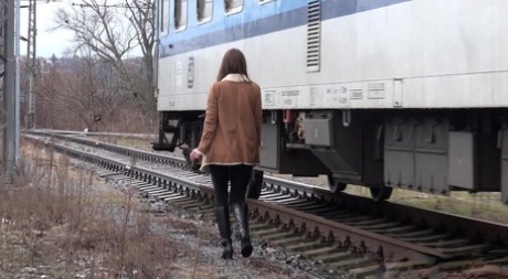 Cynthia Vellons Pulls Down Black Tights For A Quick Piss Near Railway Cars